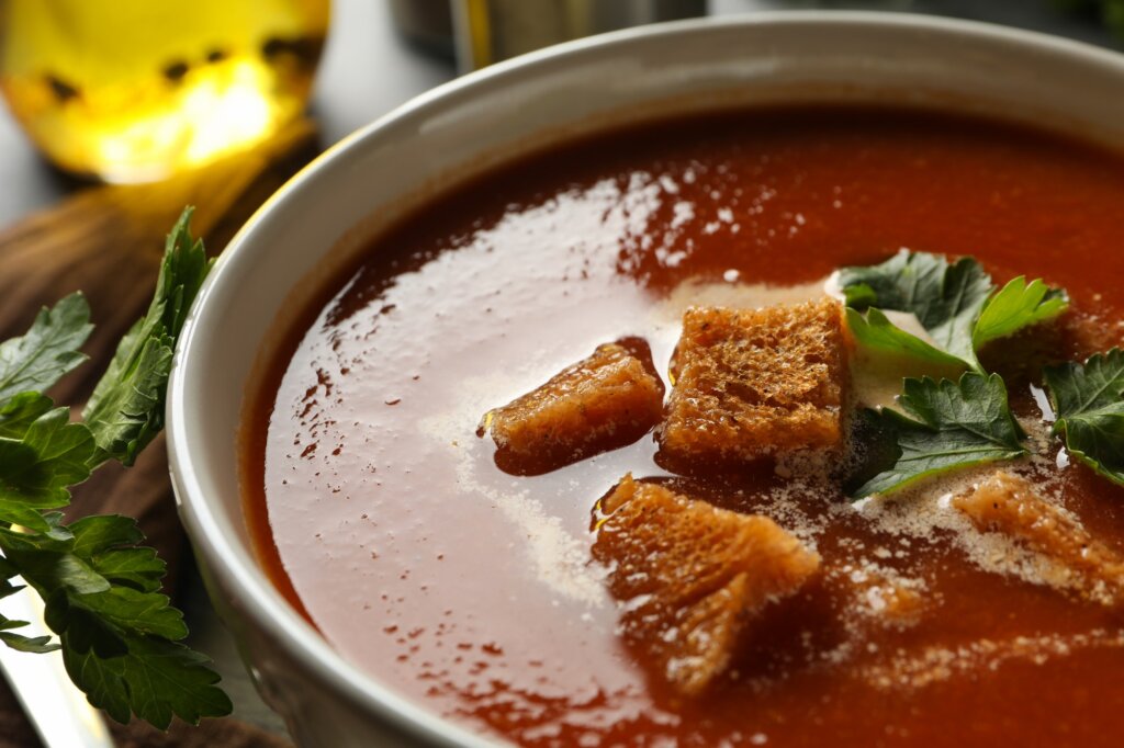 Concept of tasty food with tomato soup, close up