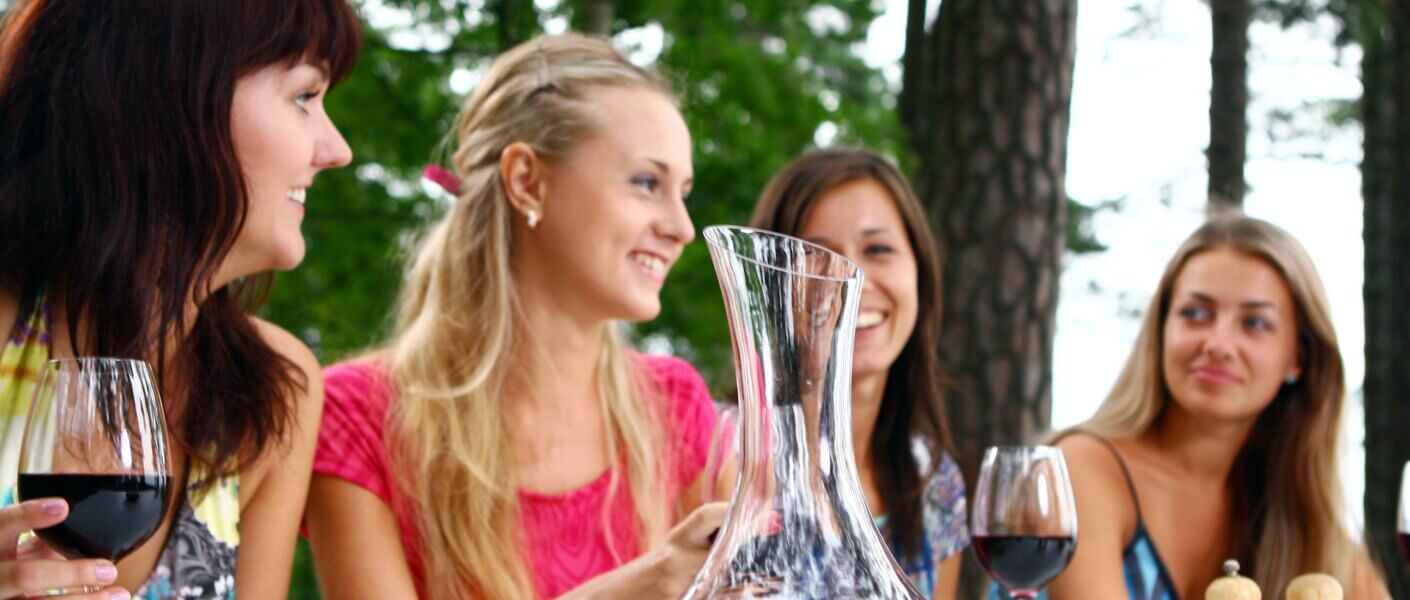group of beautiful girls drinking wine